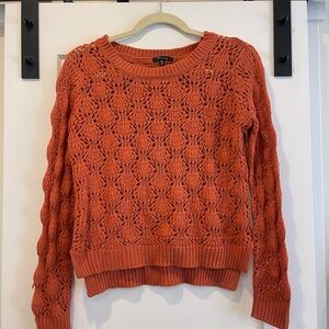 thrifted orange crochet sweater